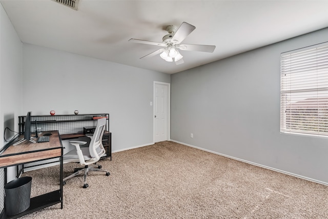 carpeted office with ceiling fan