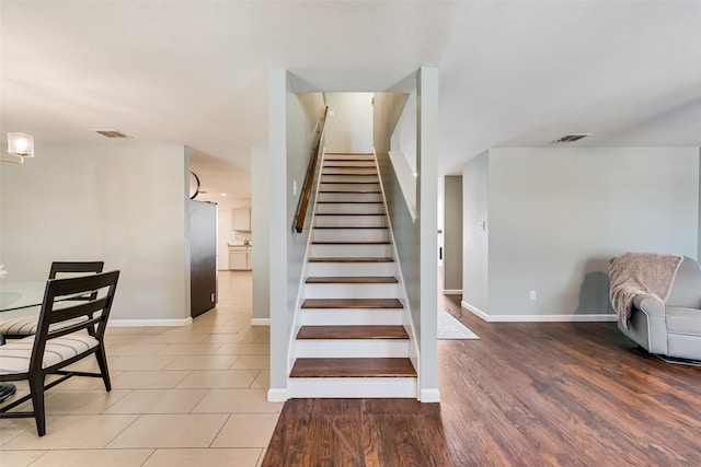 stairway with wood-type flooring