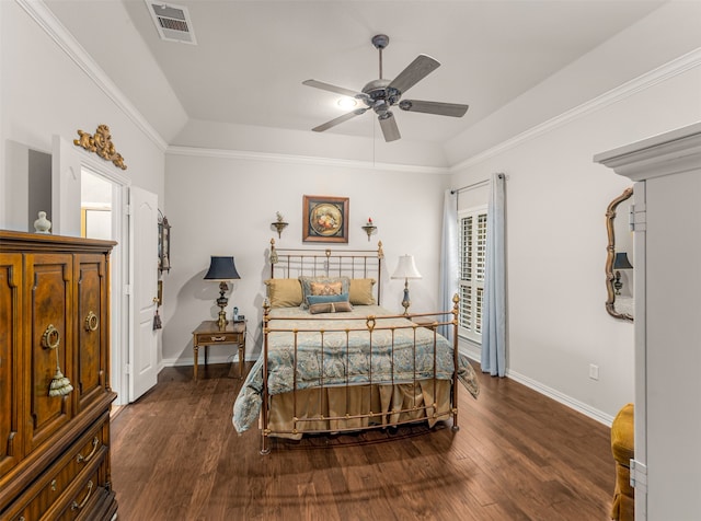 bedroom featuring dark wood-type flooring, crown molding, and ceiling fan