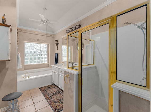 bathroom with shower with separate bathtub, ceiling fan, ornamental molding, vanity, and tile patterned floors