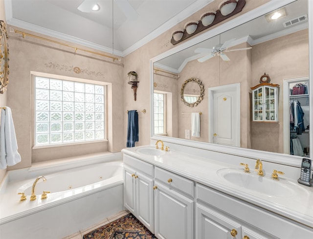 bathroom with a bathing tub, ceiling fan, ornamental molding, vanity, and tile patterned floors