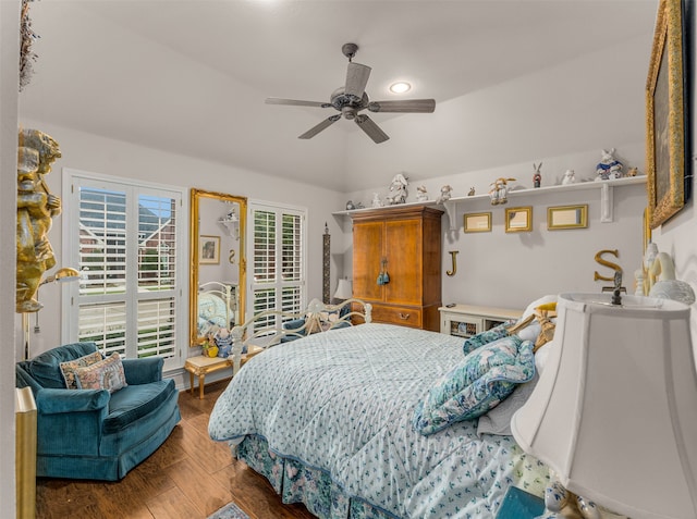 bedroom with wood-type flooring, vaulted ceiling, and ceiling fan