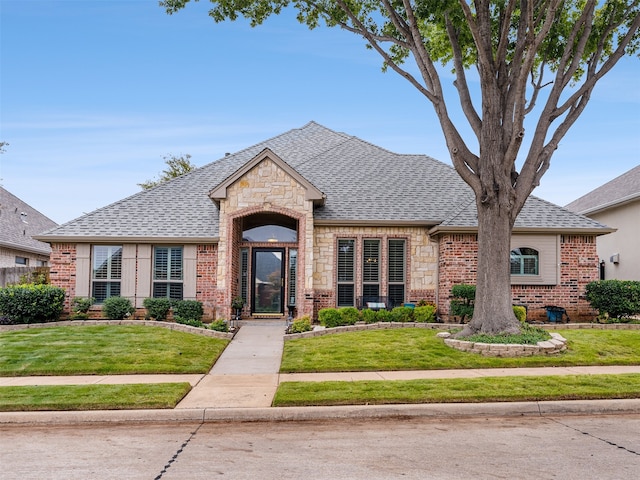 french country home with a front yard