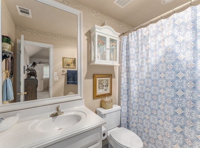 bathroom with vanity and toilet