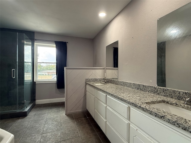 bathroom featuring vanity, walk in shower, and tile patterned floors