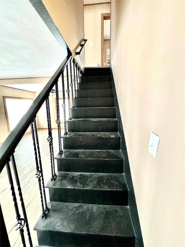 106 E Main St, Wortham, TX 76693 - stairway with wood finished floors
