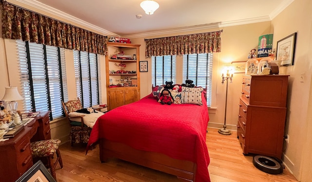 bedroom featuring crown molding and light hardwood / wood-style flooring