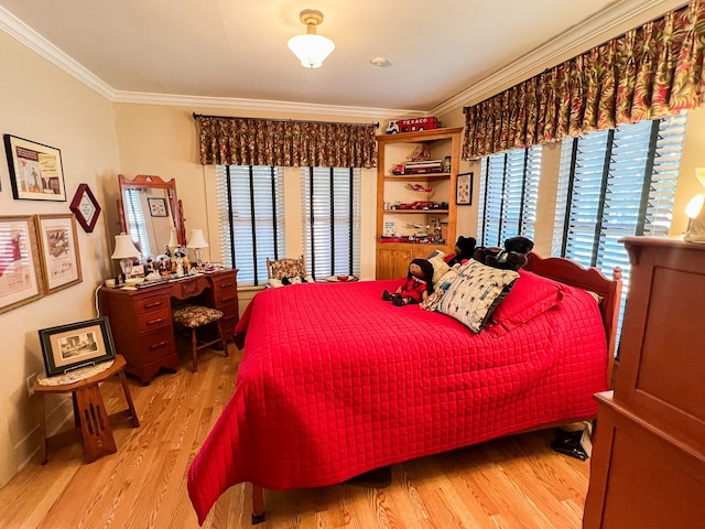 bedroom featuring ornamental molding, light hardwood / wood-style flooring, and multiple windows