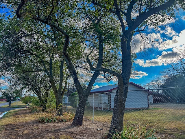 view of property exterior with a lawn