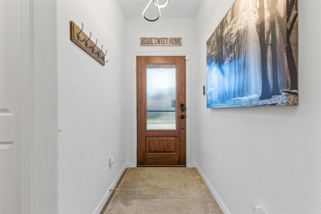 entryway with light colored carpet