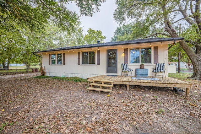 view of front of house with a wooden deck