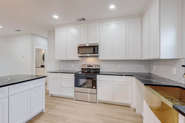 kitchen featuring light hardwood / wood-style flooring, stainless steel appliances, and white cabinets