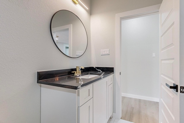 bathroom featuring vanity and hardwood / wood-style floors