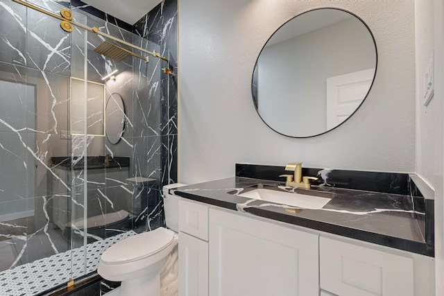 bathroom featuring toilet, walk in shower, and vanity