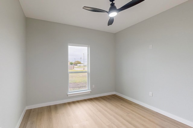 empty room featuring light hardwood / wood-style flooring and ceiling fan