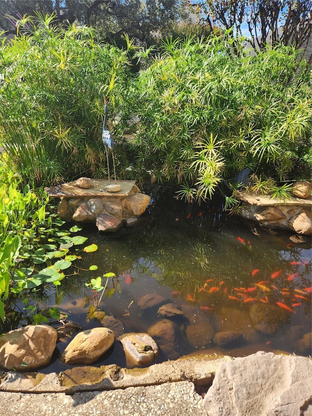 exterior details featuring a small pond