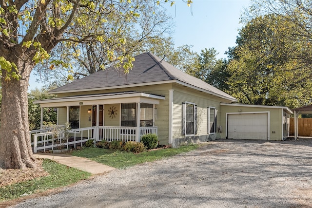 view of front facade featuring a garage and covered porch