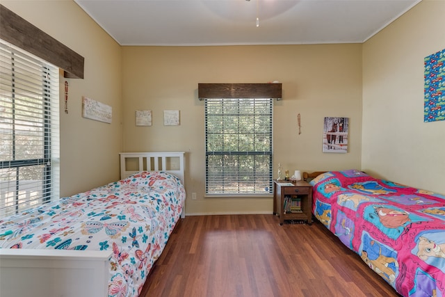 bedroom with ceiling fan and dark wood-type flooring