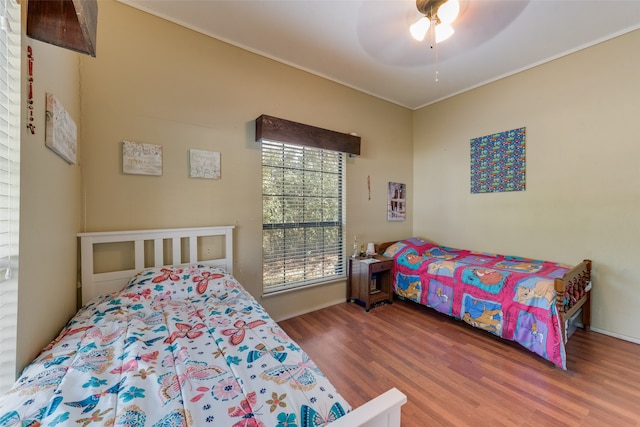 bedroom featuring ceiling fan and hardwood / wood-style flooring