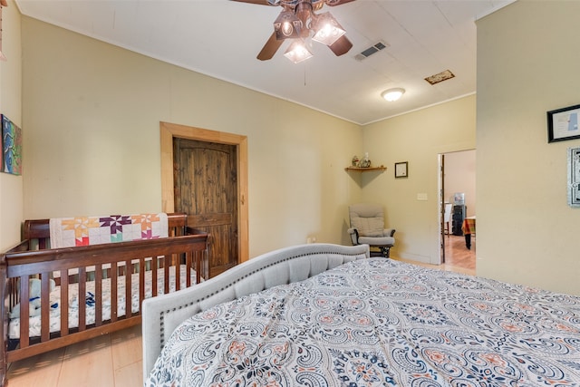 bedroom featuring ceiling fan and light hardwood / wood-style flooring