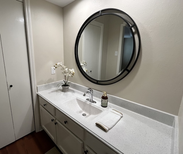 bathroom featuring vanity and wood-type flooring