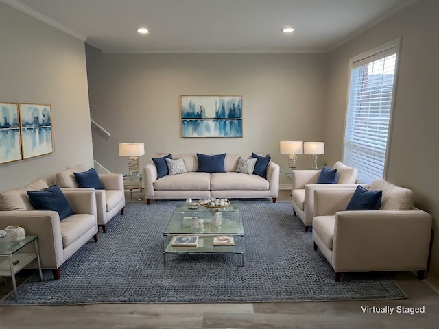 living room with wood-type flooring and crown molding