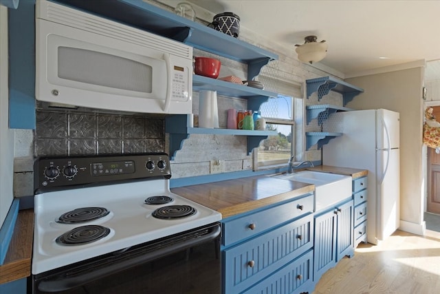 kitchen with white appliances, backsplash, blue cabinets, sink, and light wood-type flooring