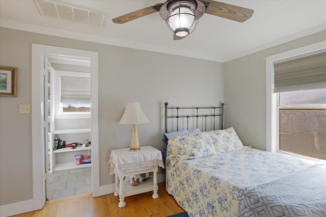 bedroom featuring ceiling fan and light hardwood / wood-style floors