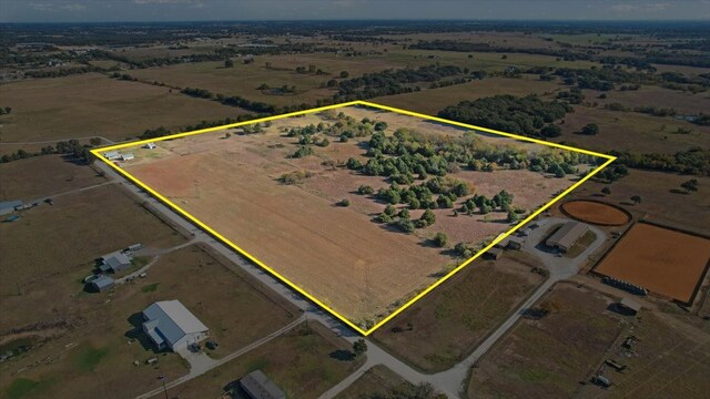 birds eye view of property featuring a rural view