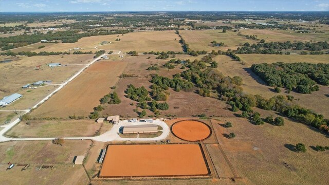 birds eye view of property with a rural view