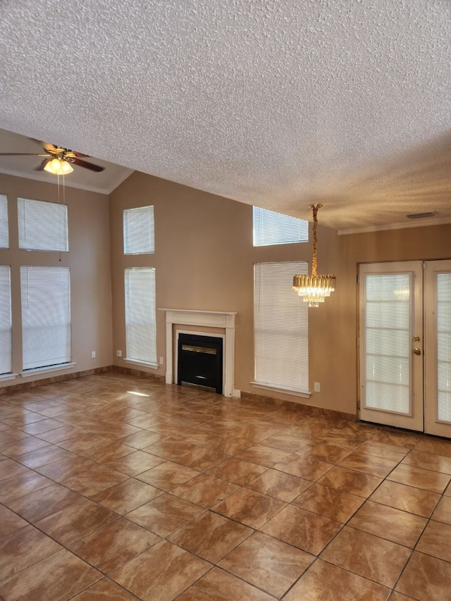 unfurnished living room with tile patterned floors, a textured ceiling, vaulted ceiling, and ceiling fan with notable chandelier