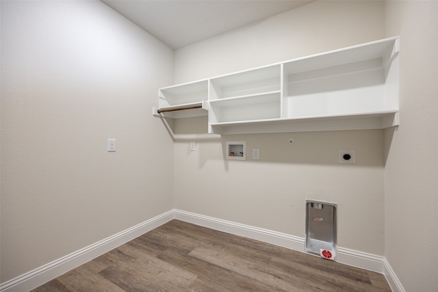 washroom with hookup for a gas dryer, hookup for an electric dryer, wood-type flooring, and hookup for a washing machine