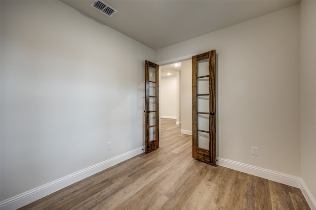 unfurnished room featuring light wood-type flooring