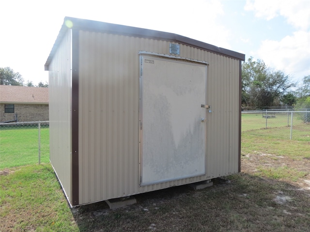 view of outdoor structure with a yard