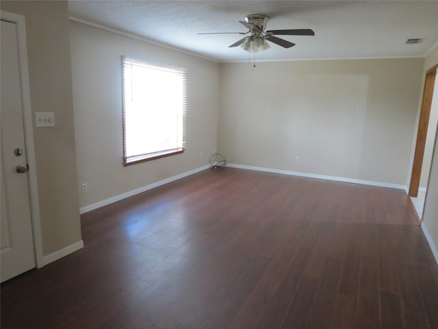 unfurnished room with ceiling fan, ornamental molding, and dark hardwood / wood-style floors