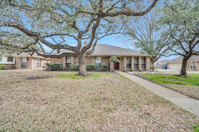 ranch-style house with a front lawn and a garage