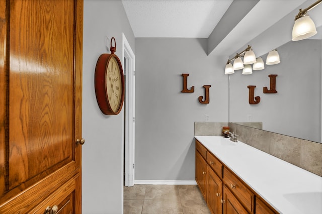 bathroom with vanity, tile patterned floors, and a textured ceiling