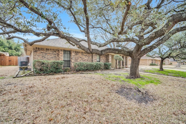 ranch-style house featuring central AC unit