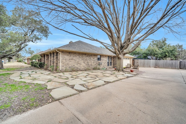 view of side of property featuring a patio