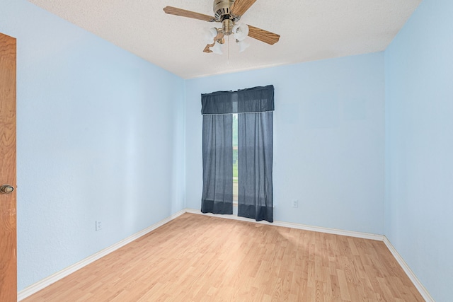 spare room with ceiling fan, a textured ceiling, and light hardwood / wood-style flooring