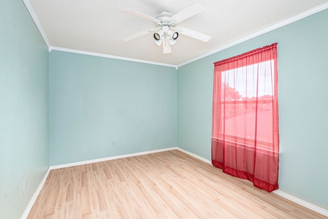 spare room with crown molding, a textured ceiling, hardwood / wood-style flooring, and ceiling fan