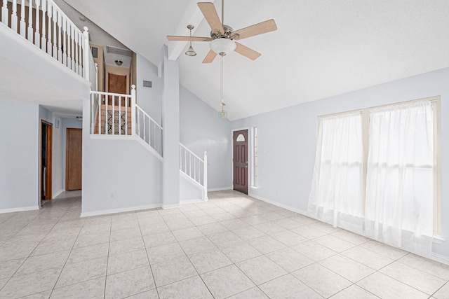 unfurnished living room featuring light tile patterned floors, high vaulted ceiling, and ceiling fan