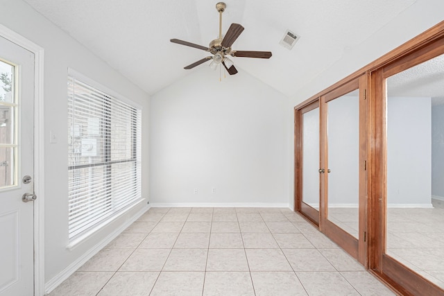 interior space featuring ceiling fan and vaulted ceiling