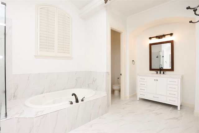 bathroom featuring tiled bath, toilet, vanity, and ornamental molding