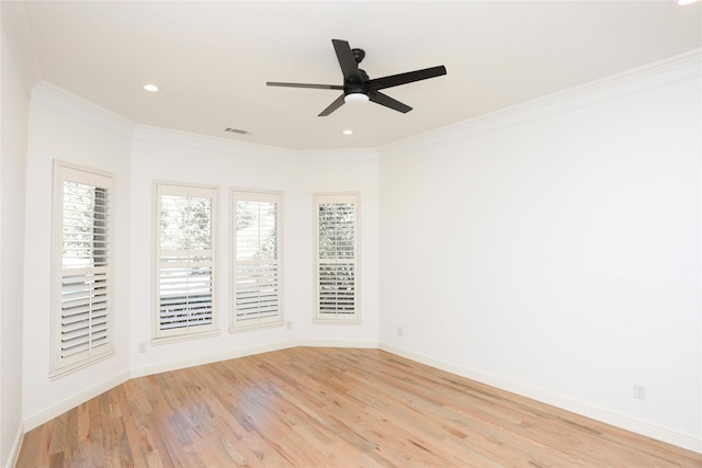 unfurnished room with ceiling fan, light wood-type flooring, and crown molding