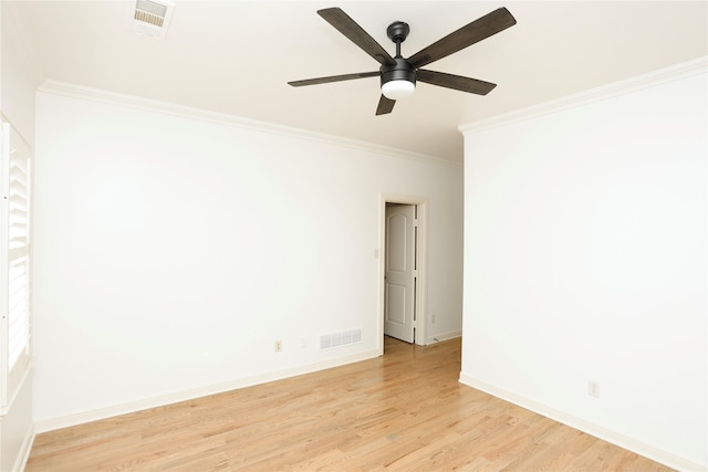 empty room featuring light hardwood / wood-style floors, ceiling fan, and crown molding