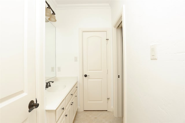 bathroom featuring crown molding, tile patterned flooring, and vanity