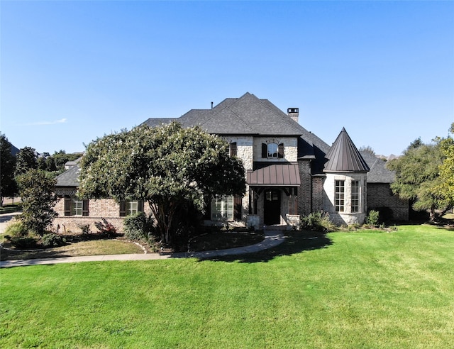 view of front of home with a front yard