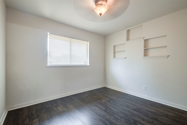 unfurnished room with dark wood-type flooring and ceiling fan