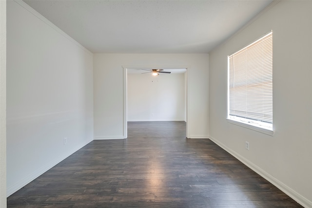 unfurnished room featuring crown molding, dark hardwood / wood-style floors, and ceiling fan